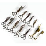 Ten pairs of various 19th century wick trimmers, including ornate steel examples,