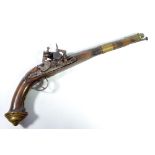 An unusual flintlock pistol, possibly Turkish, with ornate detailing throughout,