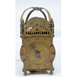 A 20th century brass lantern clock with Roman numerals to the chapter ring and dial inscribed 'Sam