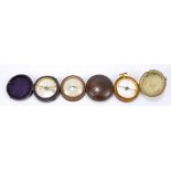 Three 19th century travel/pocket compasses, one set in a treen case with tilting dial,