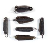 Six military issue multi blade clip knives with ring loop attachments.