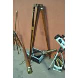 A large late 19th century mahogany folding tripod with rubber ferrule feet, length of leg 158cm,