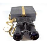 A pair of military issue x5 Bino-Prism MkIV No.456 binoculars, no.6E/383 and in associated case.