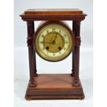 An Edwardian mahogany mantel clock with drum type movement set with Arabic numerals to the chapter