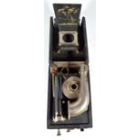 A Peter Pan travelling gramophone with printed logo to the speaker, length 17.5cm.