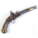 An unusual flintlock pistol fitted with miquelet lock, engraved banded barrel,
