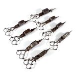 Eight pairs of 19th century steel wick trimmers,