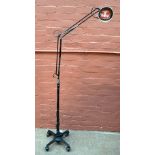 An original mid-20th century floor standing adjustable standard lamp with four spoke base on