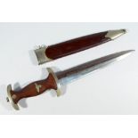 A WWII period German Third Reich SA dagger, with inset insignia to the brown wooden handle,
