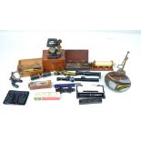 A group of travelling/pocket size scientific instruments including microscopes and magnifying