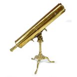 An unnamed 19th century 4" brass telescope, raised on brass tripod, length 76cm.