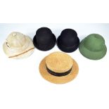 A group of five hats to include two safari type examples, one with internal label for Sing Chao K.