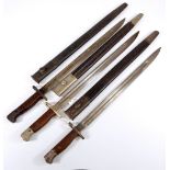 Three military issue wooden and steel handled bayonets,