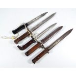 Five various small bayonets, one with scabbard (5).