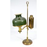 A 19th century brass student's lamp with repainted cream and green shade,