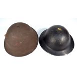 Two WWII period helmets, a US M1 with textured finish and a Brodie type,