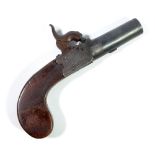 A small percussion cap muff pistol with screw-off barrel, engraved lock and checkered walnut stock,