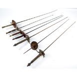 A 19th century épée and six 19th century fencing foils with various grips (7).