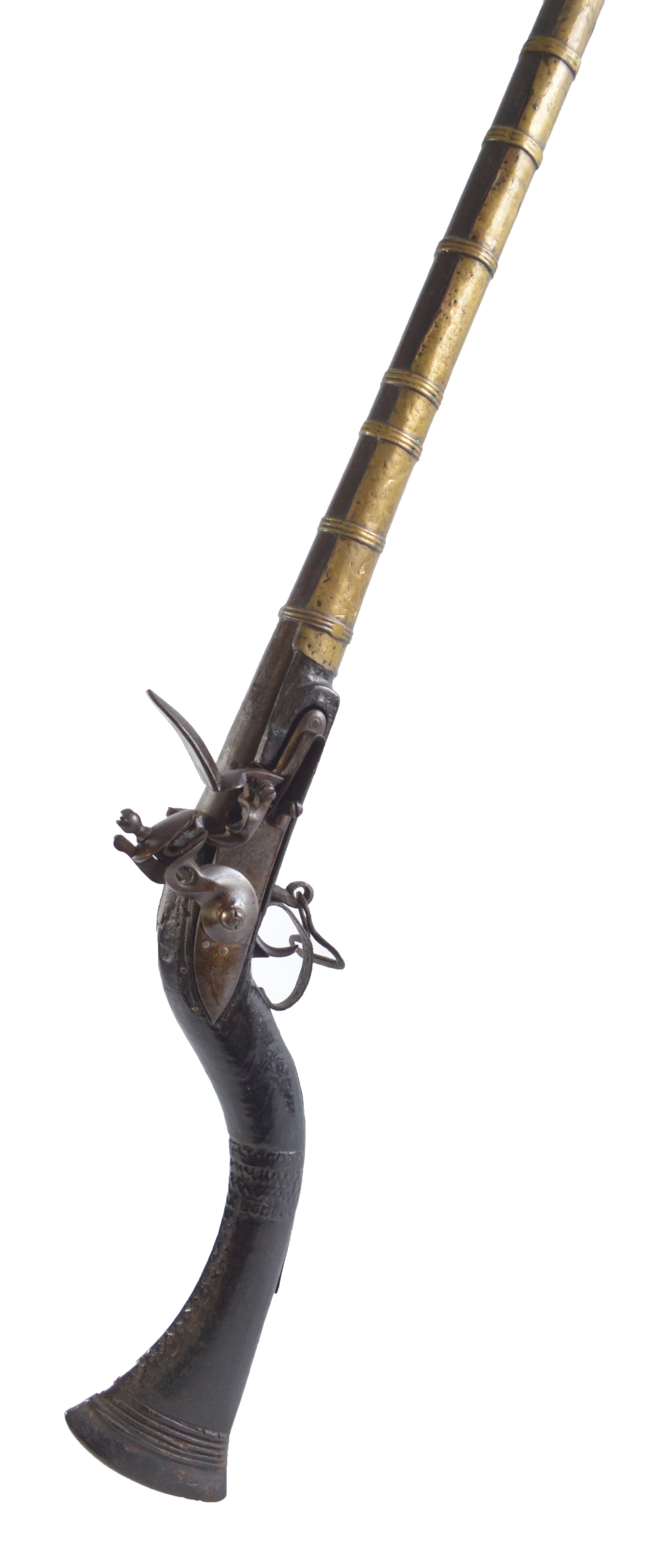 A 19th century Afghan Jezail flintlock musket with incised decoration and brass barrel cover,