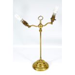 An early 20th century brass adjustable two branch table lamp with adjustable central section and