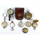 A collection of pocket compasses including brass cased example by Negretti & Zambra,