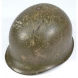 A German mid-20th century green painted helmet with internal painted stamp '55-57' and leather