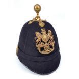A late 19th/early 20th century Royal Artillery black cloth ball topped helmet with brass RA badge