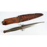 A Sykes Fairbairn type commando knife, with horizontal ring grip and shaped blade,