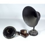 A tin loud speaker on circular base, a small horn and a bakelite speaker (3).