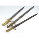 Three brass handled bayonets, all without scabbards (3).