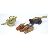 A group of five model cannons to include two larger brass examples,