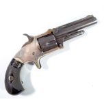 A five shot rimfire revolver, the top of the barrel stamped 'XXX Standard 1872',