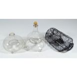 Two 19th century clear glass insect traps, and a mesh small rodent trap (3).