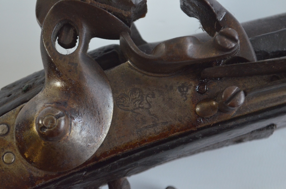 A 19th century Afghan Jezail flintlock musket with incised decoration and brass barrel cover, - Image 2 of 8