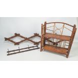 An early 20th century freestanding two tier folding shelf unit with part bamboo structure,