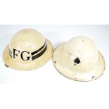 A British WWII period cream painted Brodie type fire guard helmet with internal leather liner and