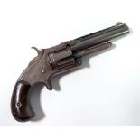 A five shot rimfire revolver, the top of barrel stamped 'Smith & Wesson, Springfield, Mass. Pat.