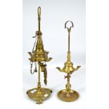 A 19th century Colza brass four branch oil lamp with turned circular base and three scrolling feet,