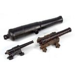 Three model signal cannons, one large and heavy iron example, length 38cm,