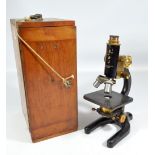 FLATTERS & GARNETT LTD OF MANCHESTER; a cased monocular 'Precision' microscope, no.4727, height 30.