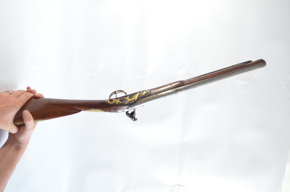 A cut down brass Brown Bess style flintlock musket with later lock plate, length 85cm. - Image 2 of 2