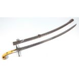 An early 19th century Mameluke, with shaped ivory grip, crossguard, curved blade and metal scabbard,