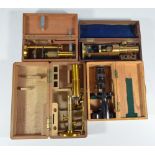 A cased Cuff type travelling brass microscope and three further cased travelling microscopes (4).