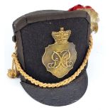 An early 20th century black cloth high fronted and peaked military dress hat/cap with G R Royal