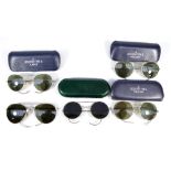 Four pairs of vintage military issue aviator type sunglasses;