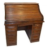 A 1920s oak twin pedestal roll top desk.