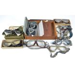 A collection of vintage flying and other goggles including a canvas cased pair of anti-mine