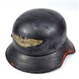 A German Third Reich Luftschutz warden's steel helmet with applied decal to front,