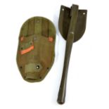 A mid-20th century US military green painted folding spade, the blade stamped 'US Ames 1967',