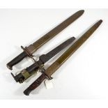 Three American bayonets with scabbards.